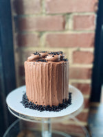 Load image into Gallery viewer, Chocolate cake with chocolate buttercream frosting.
