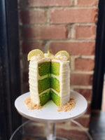 Load image into Gallery viewer, Key lime cake with lime cream cheese frosting.
